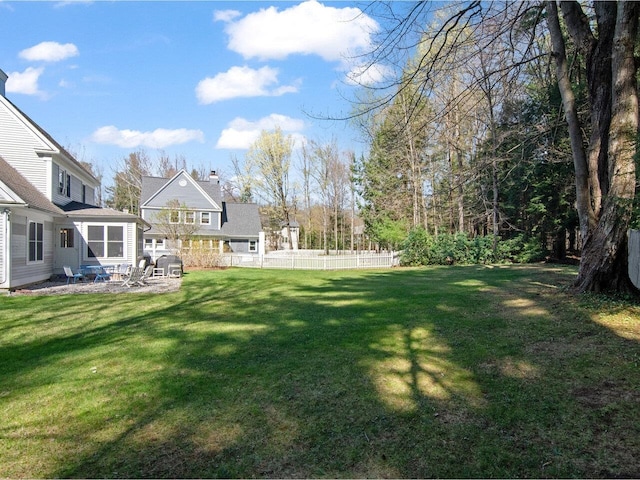view of yard with a patio and fence
