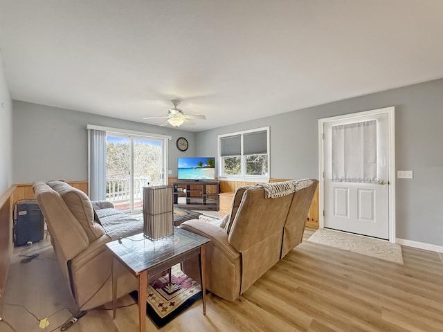 living room featuring ceiling fan and light wood-style flooring
