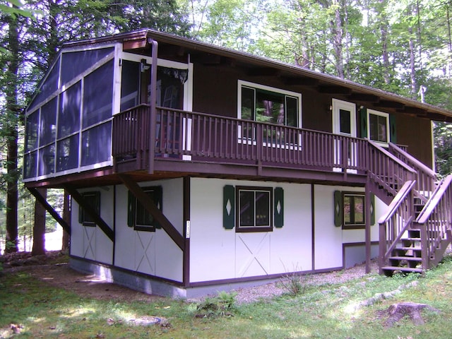 118 Suissevale Ave, Moultonborough, NH 03254 - rear view of house with stairway, a sunroom, and a deck