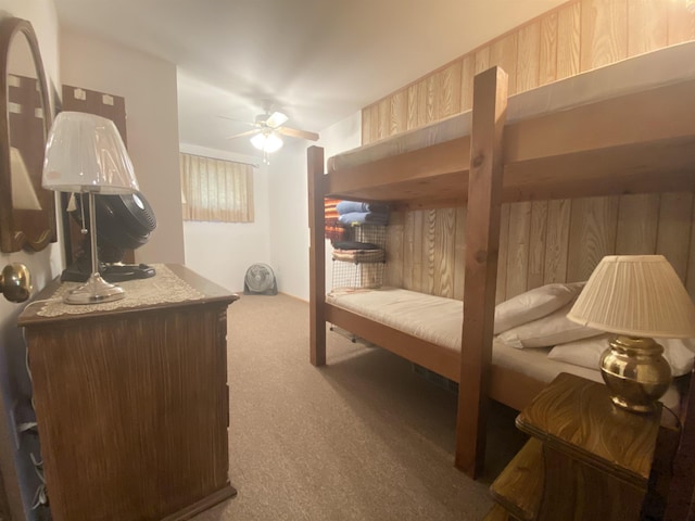 bedroom with carpet flooring, ceiling fan, and a sauna
