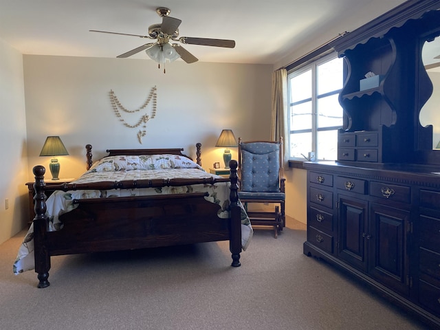 carpeted bedroom with a ceiling fan