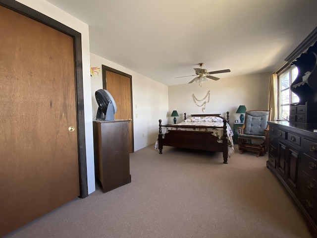 bedroom featuring ceiling fan and light colored carpet