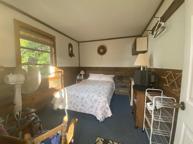bedroom featuring wainscoting and carpet