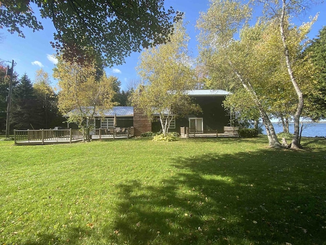 view of yard featuring a wooden deck