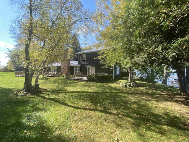 view of yard featuring a wooden deck