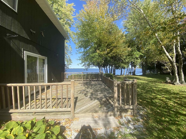 view of yard featuring a deck with water view
