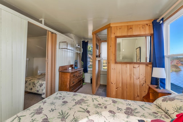 bedroom with wooden walls