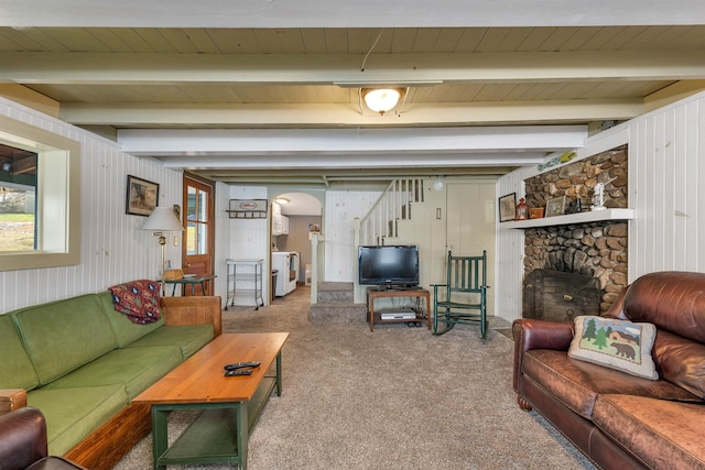 carpeted living area with wooden ceiling, arched walkways, plenty of natural light, and washer and clothes dryer