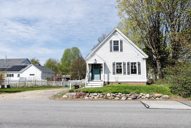 bungalow-style home featuring fence