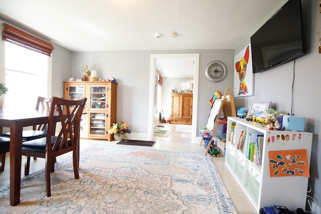 game room with light tile patterned flooring