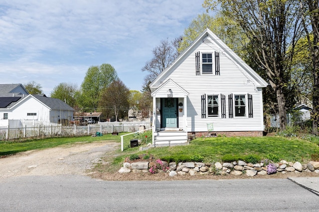 view of front of property with fence and a front yard