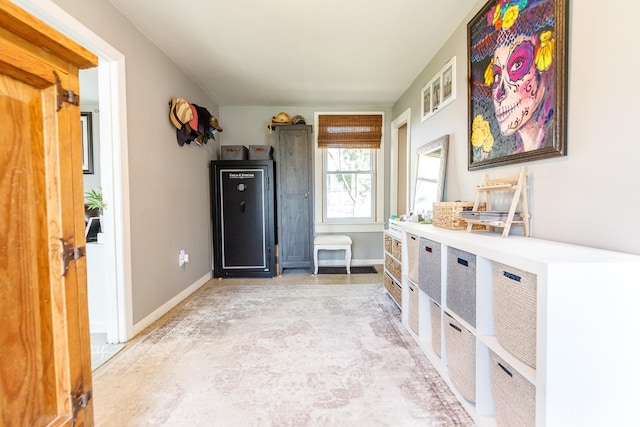 interior space featuring baseboards