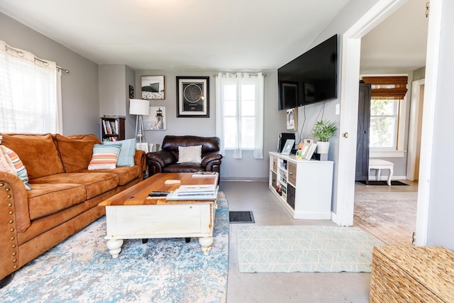 living room featuring baseboards