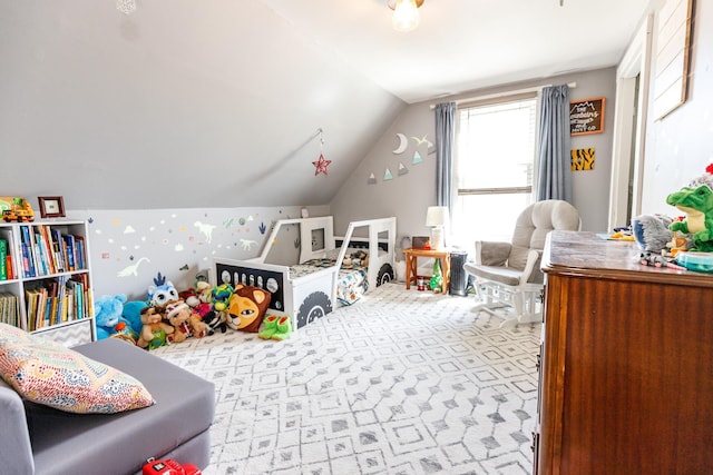 playroom featuring carpet and lofted ceiling