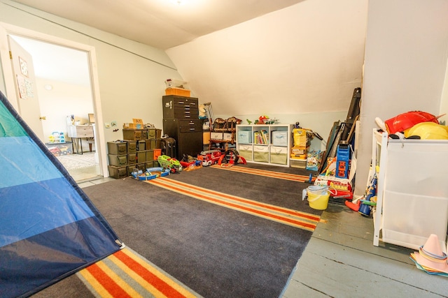 rec room featuring lofted ceiling