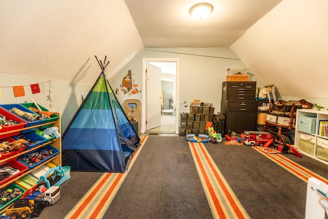rec room featuring carpet flooring and lofted ceiling
