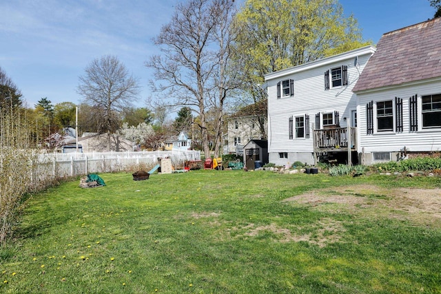 view of yard with a fenced backyard and a playground