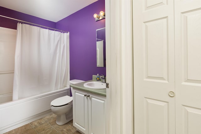 bathroom featuring vanity, shower / bathtub combination with curtain, and toilet