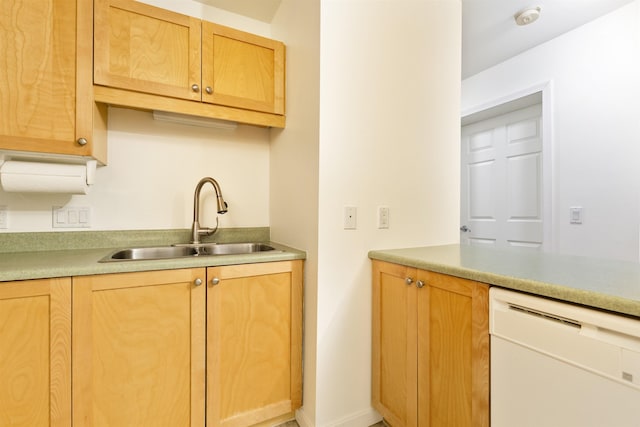 kitchen with a sink, dishwasher, light brown cabinets, and light countertops
