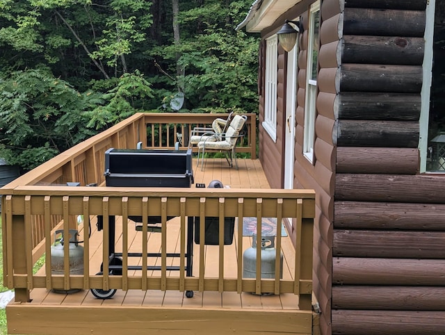wooden terrace featuring grilling area