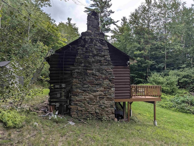 view of outbuilding featuring a wooded view