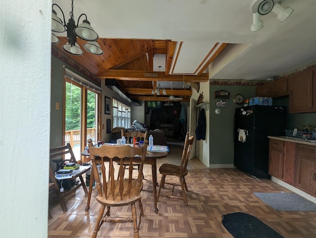 dining room featuring vaulted ceiling and an inviting chandelier