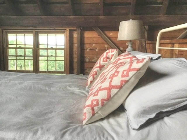 bedroom with wood walls