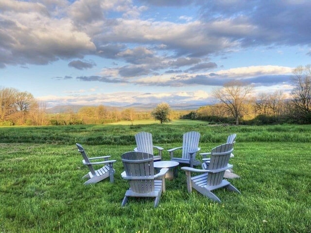 yard at dusk featuring a fire pit