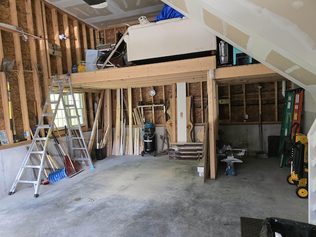 miscellaneous room featuring unfinished concrete floors