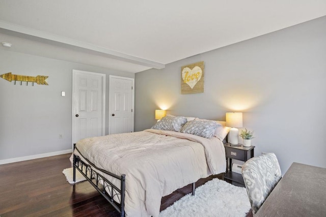 bedroom featuring baseboards and wood finished floors