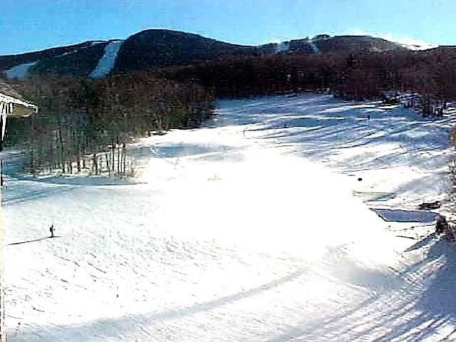 snowy yard featuring a mountain view