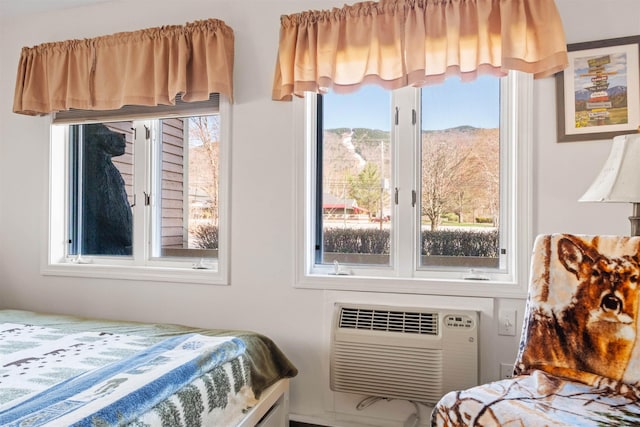 bedroom with a wall mounted AC