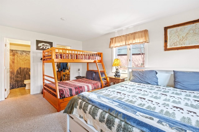 carpeted bedroom with ensuite bath