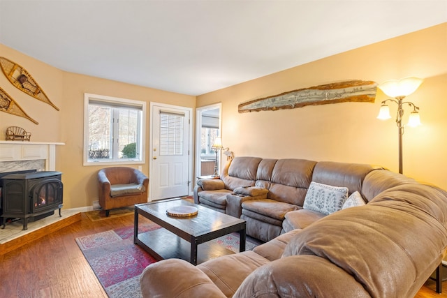 living area with baseboards and hardwood / wood-style flooring