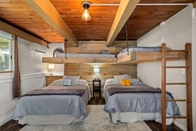 bedroom featuring beamed ceiling, a wall mounted AC, wood ceiling, and wood finished floors