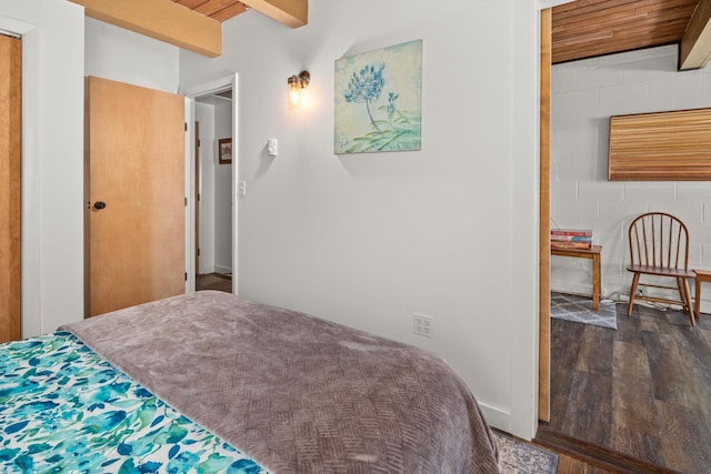 bedroom featuring wood ceiling, dark wood-style floors, and beam ceiling