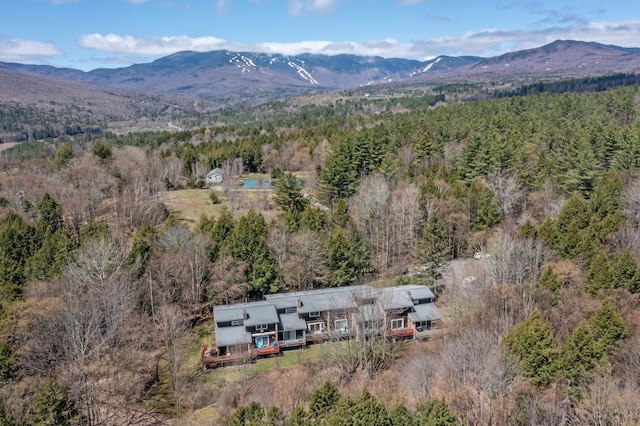 drone / aerial view featuring a mountain view and a wooded view