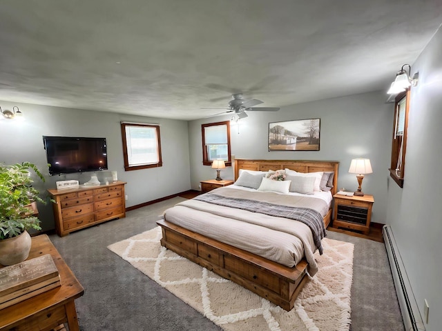 carpeted bedroom with baseboards, a baseboard radiator, and a ceiling fan