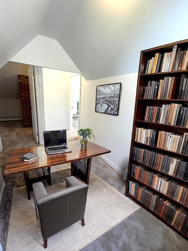 office space with carpet floors, baseboards, vaulted ceiling, and a baseboard heating unit