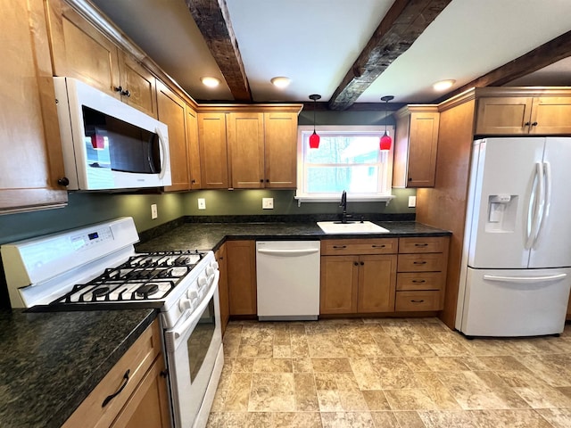 kitchen featuring pendant lighting, white appliances, beamed ceiling, stone finish floor, and a sink