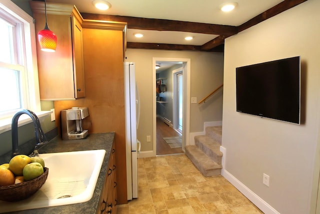 interior space with stone finish floor, vanity, baseboards, beamed ceiling, and recessed lighting