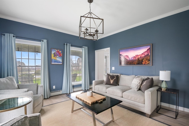 living area with baseboards, ornamental molding, wood finished floors, and a notable chandelier