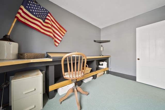 carpeted office space with baseboards