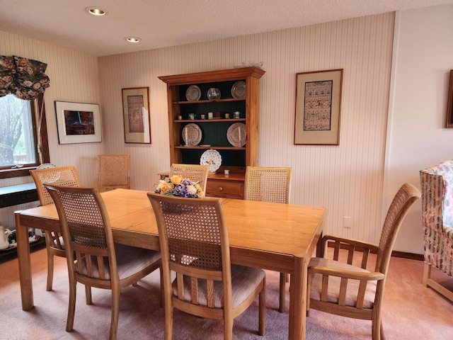 dining room with light colored carpet, recessed lighting, and radiator heating unit