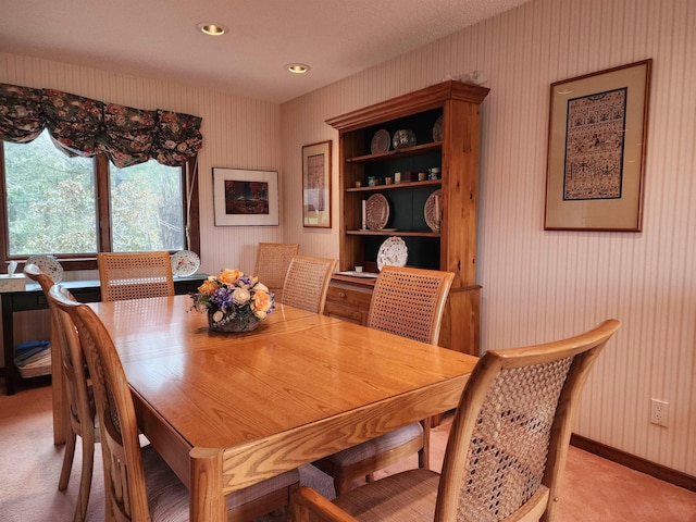 dining area with baseboards, recessed lighting, light carpet, and wallpapered walls