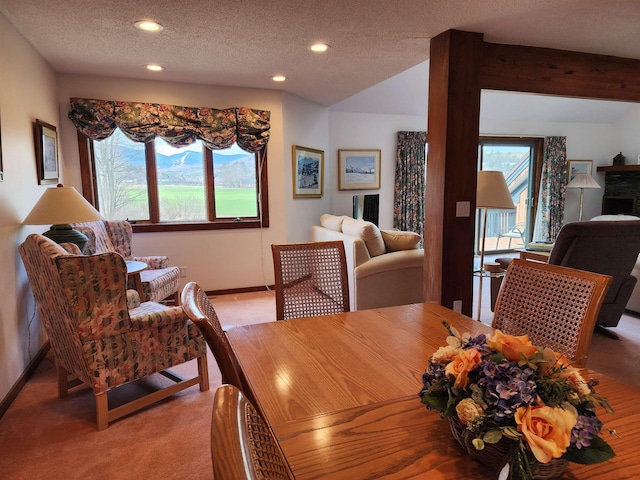 dining room with light colored carpet, recessed lighting, baseboards, and a healthy amount of sunlight