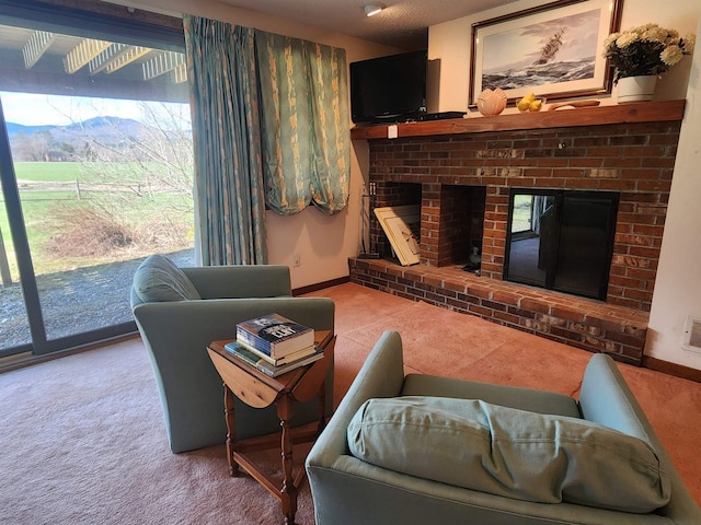 living room with a brick fireplace, baseboards, visible vents, and carpet