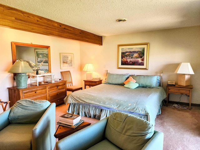 carpeted bedroom featuring beam ceiling, a textured ceiling, and visible vents