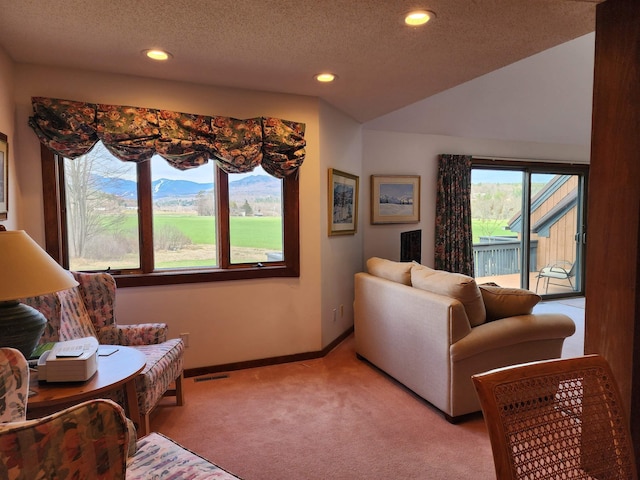 living area with recessed lighting, baseboards, light colored carpet, and visible vents