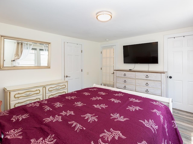 bedroom featuring wood finished floors